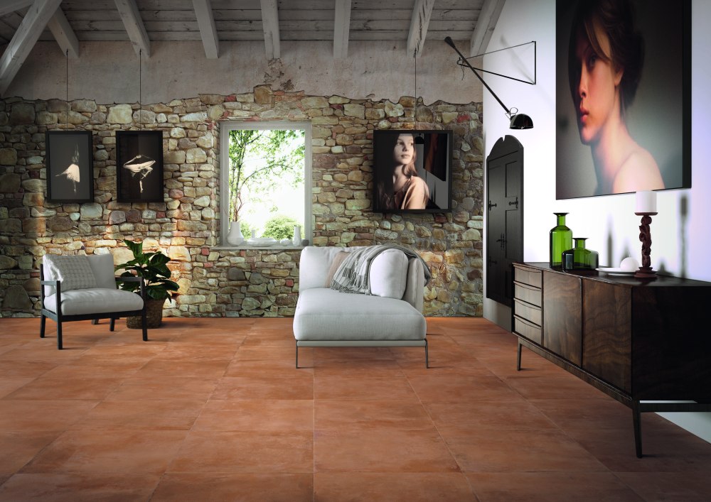 Kakeldaxgruppen-vardagsrum med cotti d'italia på golvet och stenvägg